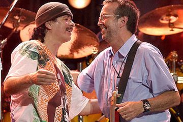 Carlos Santana Hugging Eric Clapton at Crossroads Guitar Festival 2004